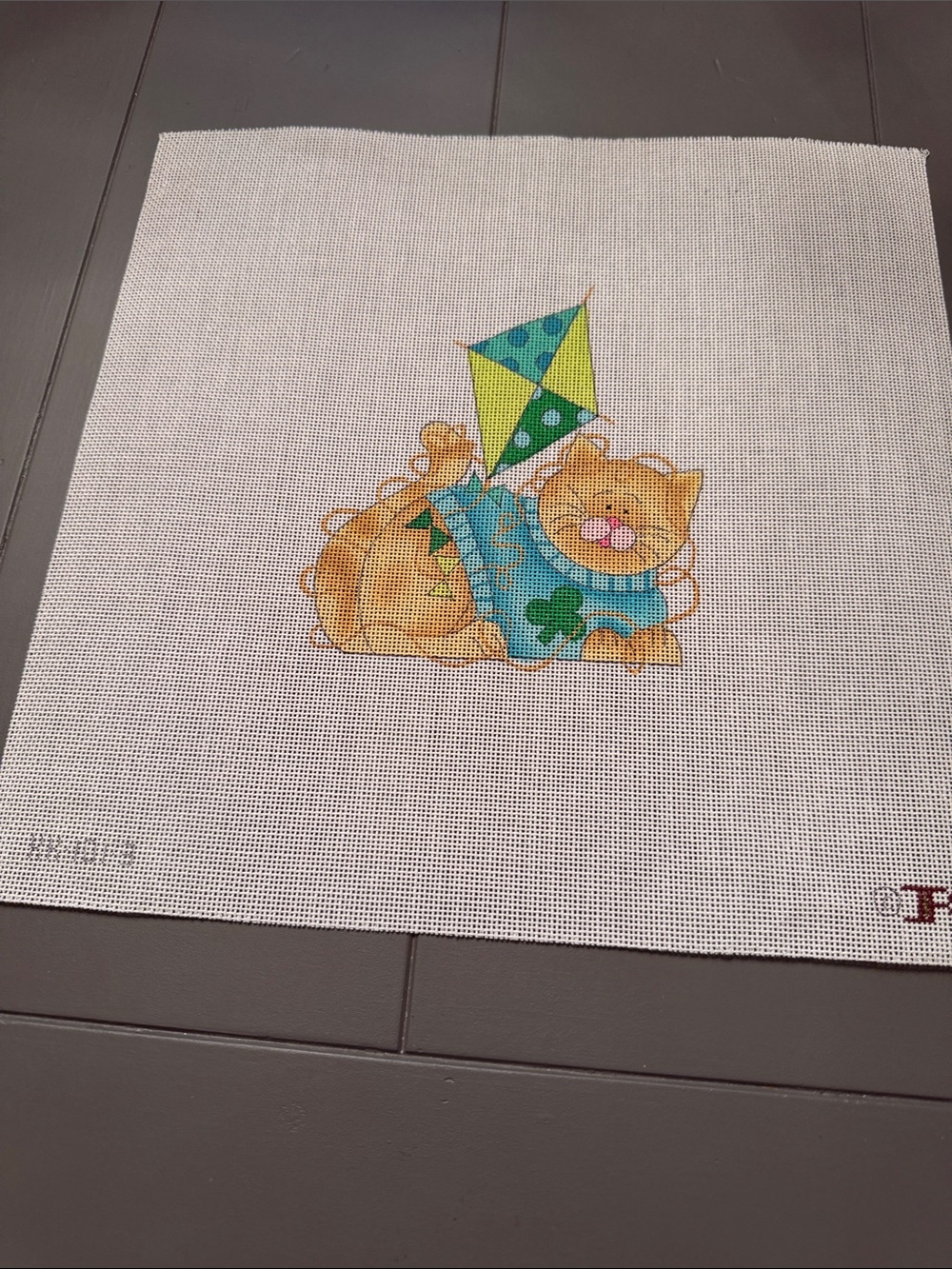 Kitty Kay’s needlepoint canvas featuring a colorful cat flying a kite. 🐈‍⬛ kit